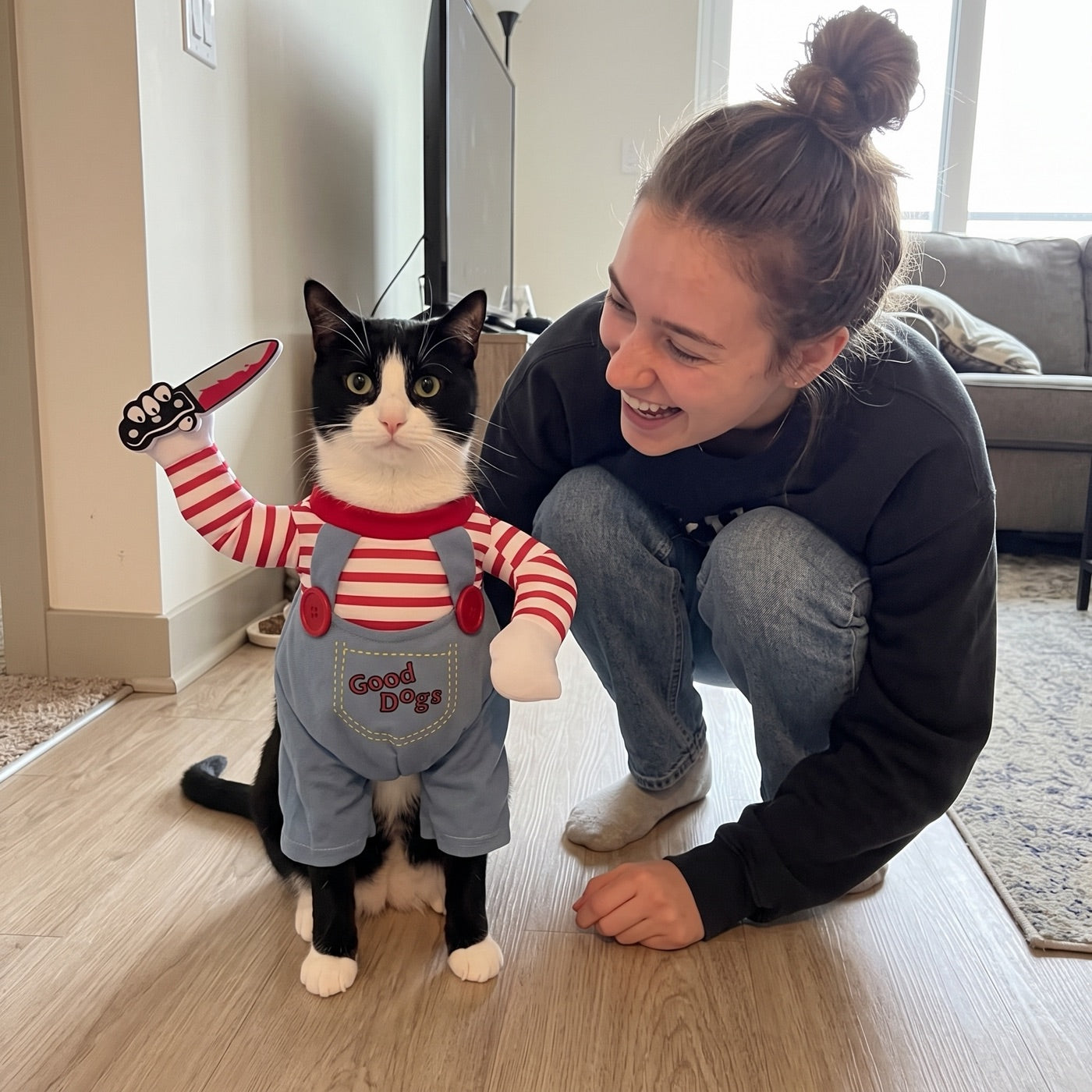 Chloe laughing with her black and white cat in the Killer Kittens costume